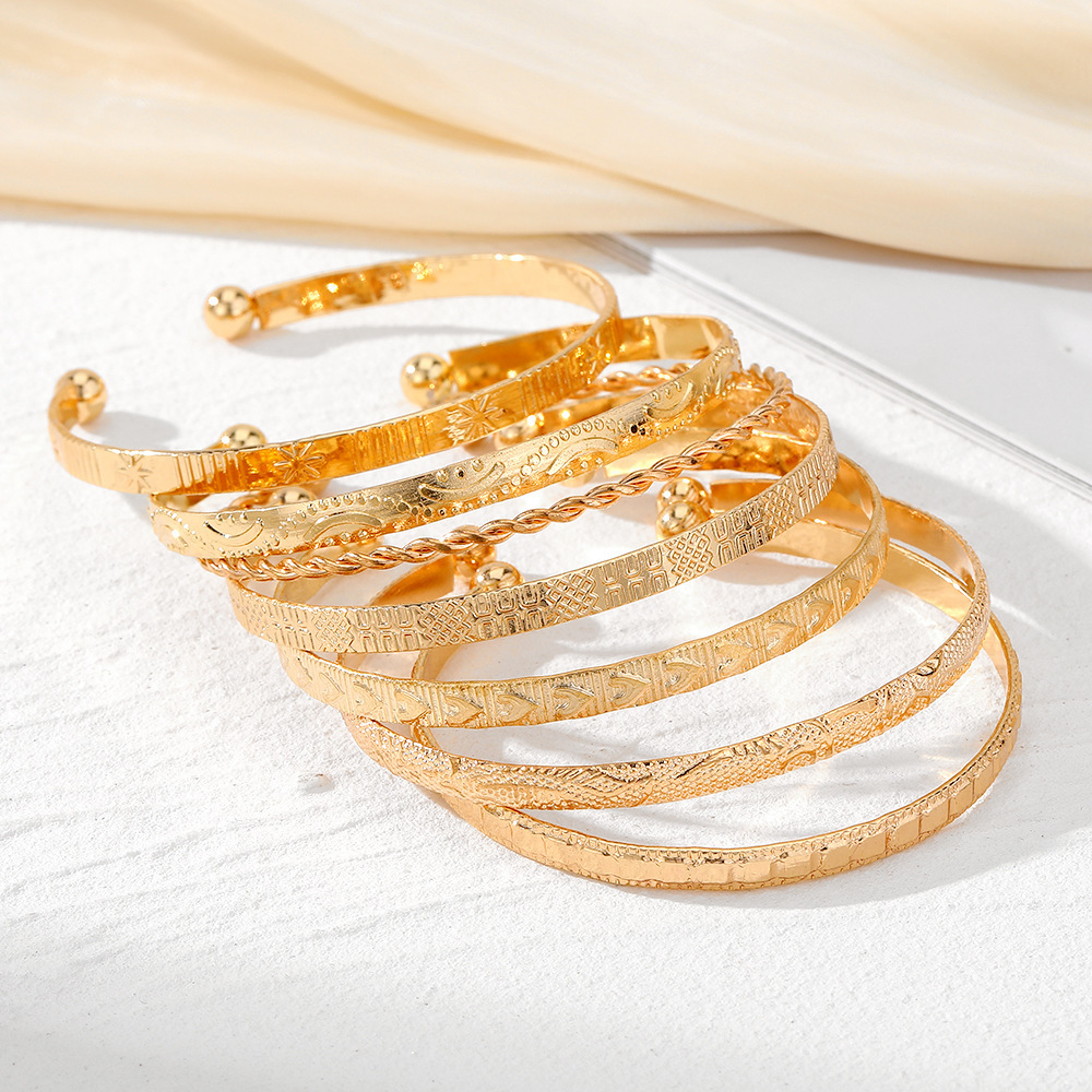 7-Piece Braided Open Bracelet Set with Star and Geometric Patterns - Image 2