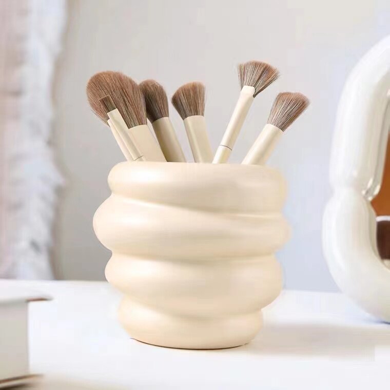 Eye shadow brush, eyebrow pencil, applicator tube