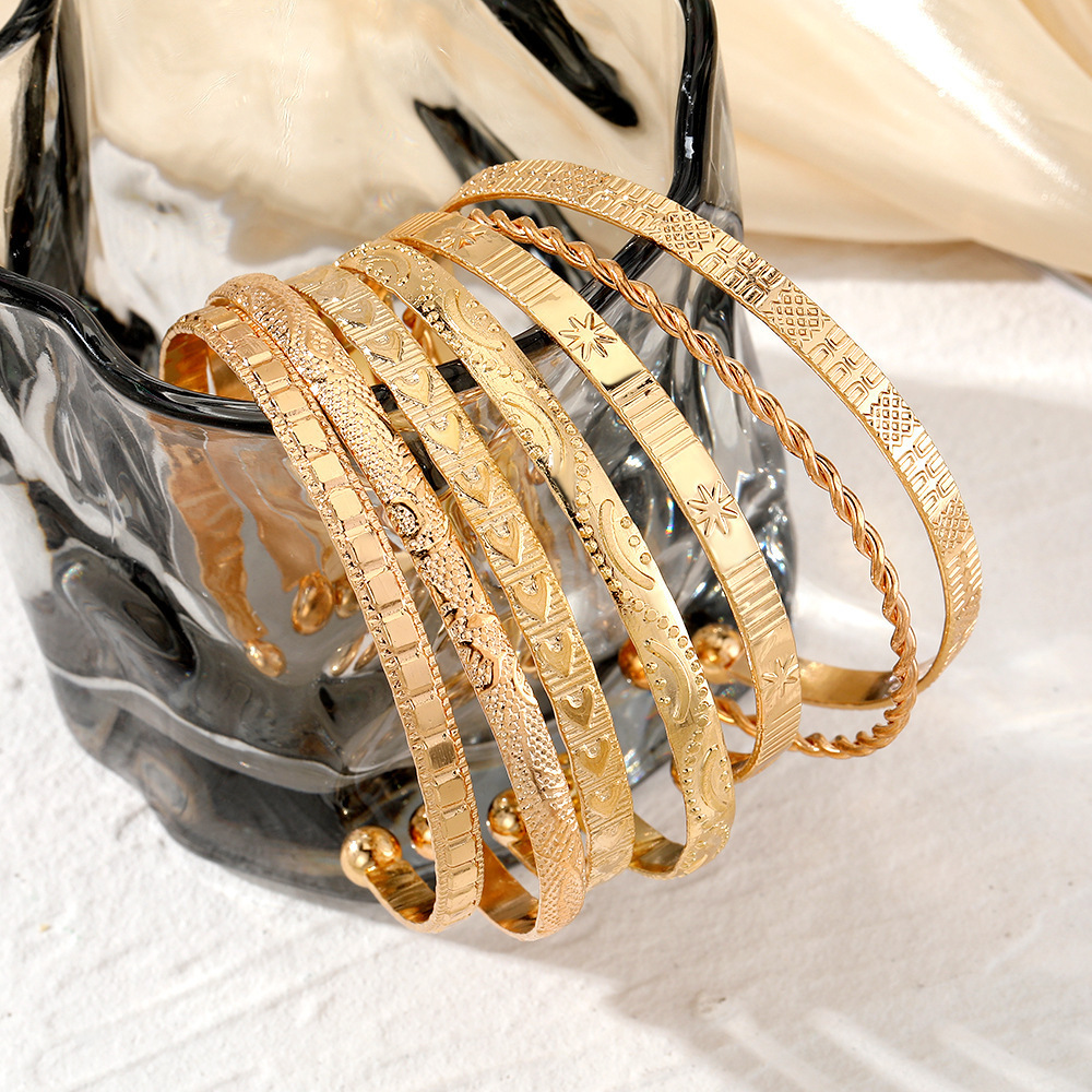 7-Piece Braided Open Bracelet Set with Star and Geometric Patterns - Image 5