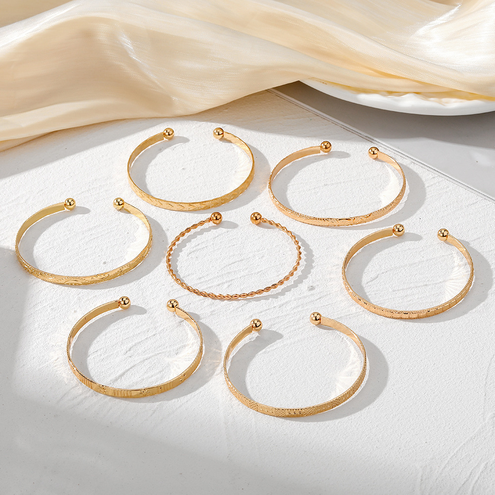 7-Piece Braided Open Bracelet Set with Star and Geometric Patterns - Image 4